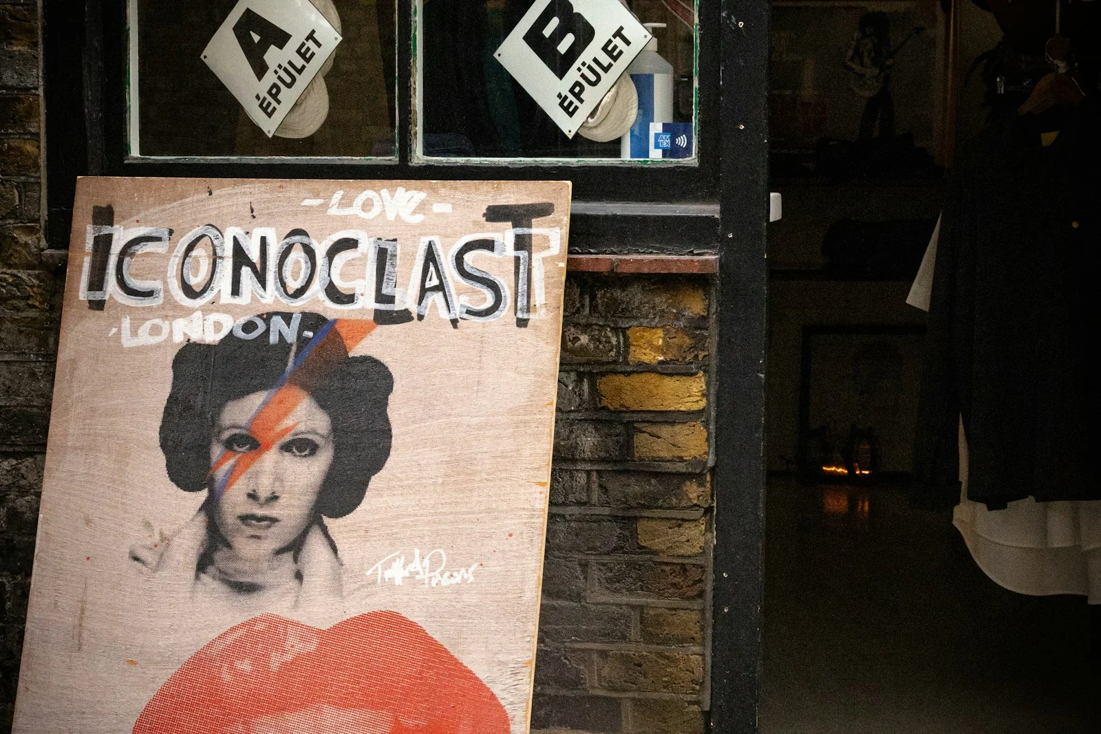 A shop sign featuring a david bowie tribute