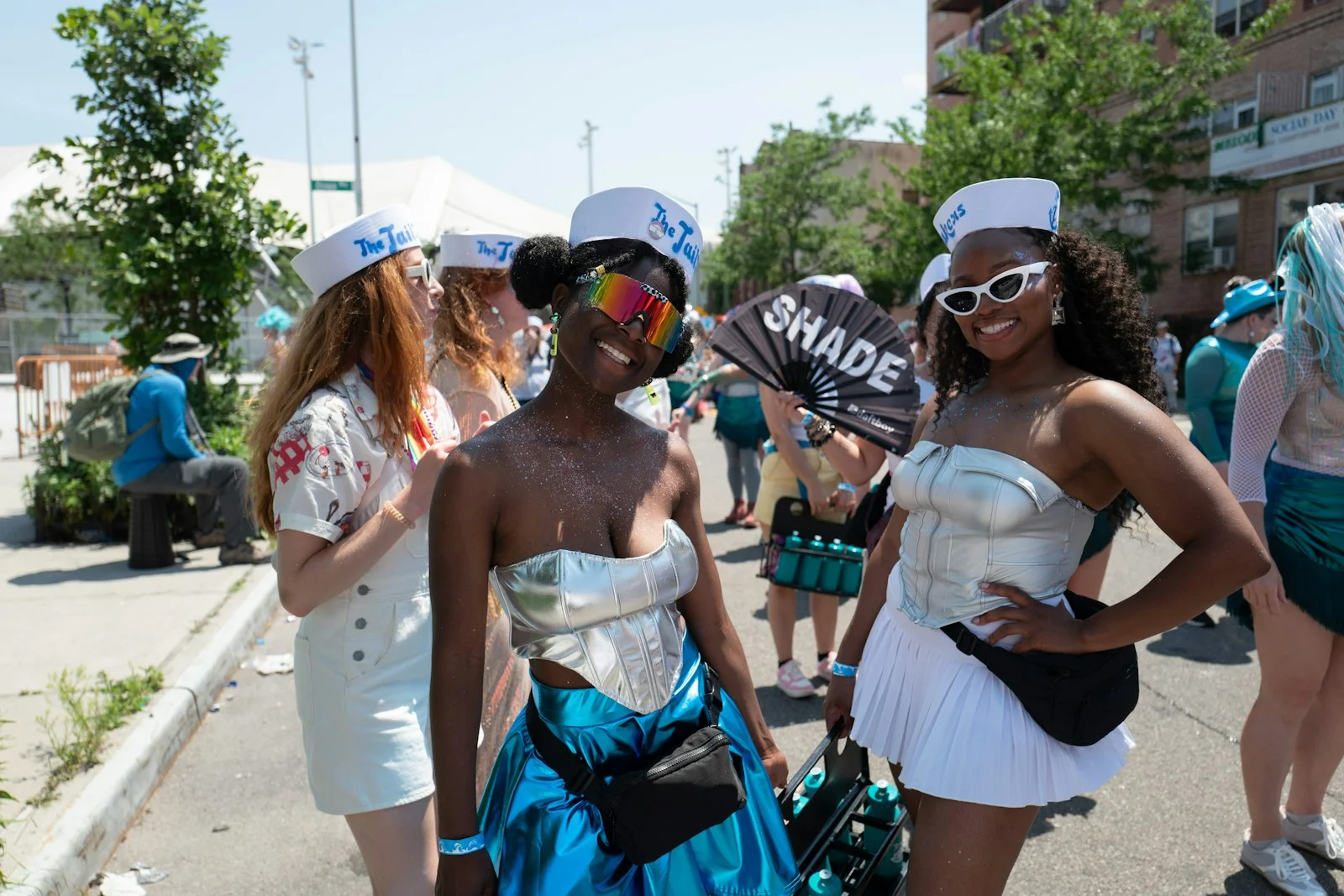 Two women in sailor costumes at a parade Two women in sailor costumes at a parade