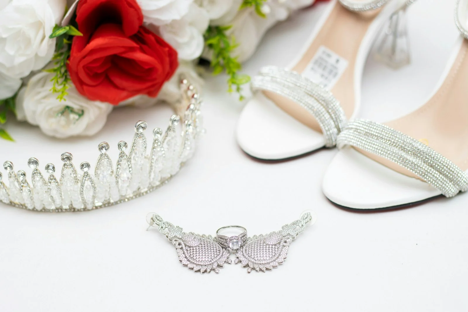 a pair of shoes and a tiara on a table a pair of shoes and a tiara on a table